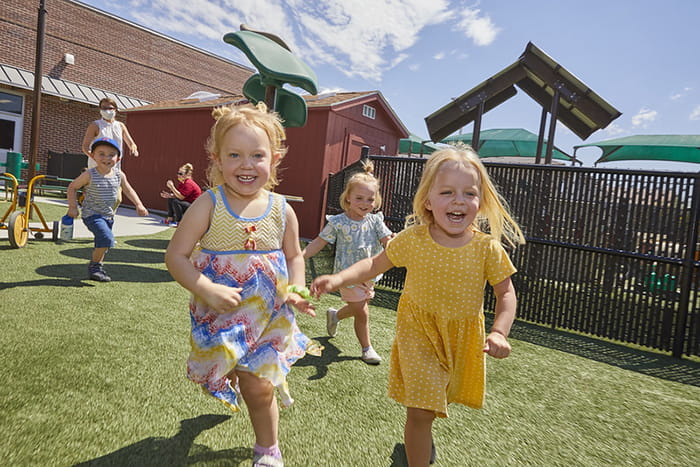 children running together on outdoor playground